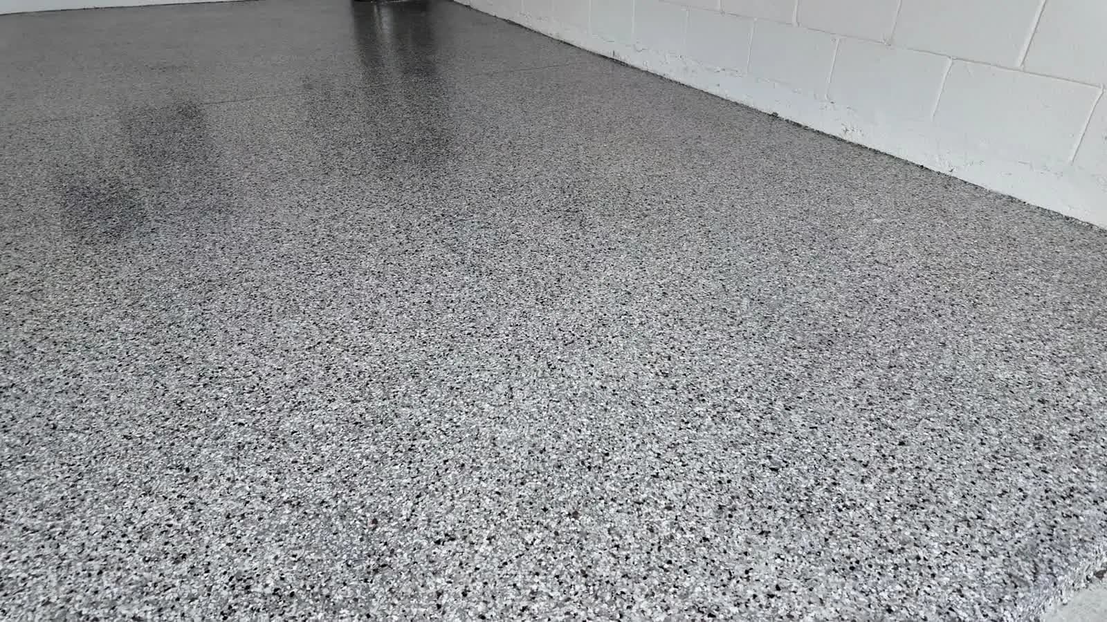 Freshly installed grey flake epoxy garage floor coating in Central Florida
