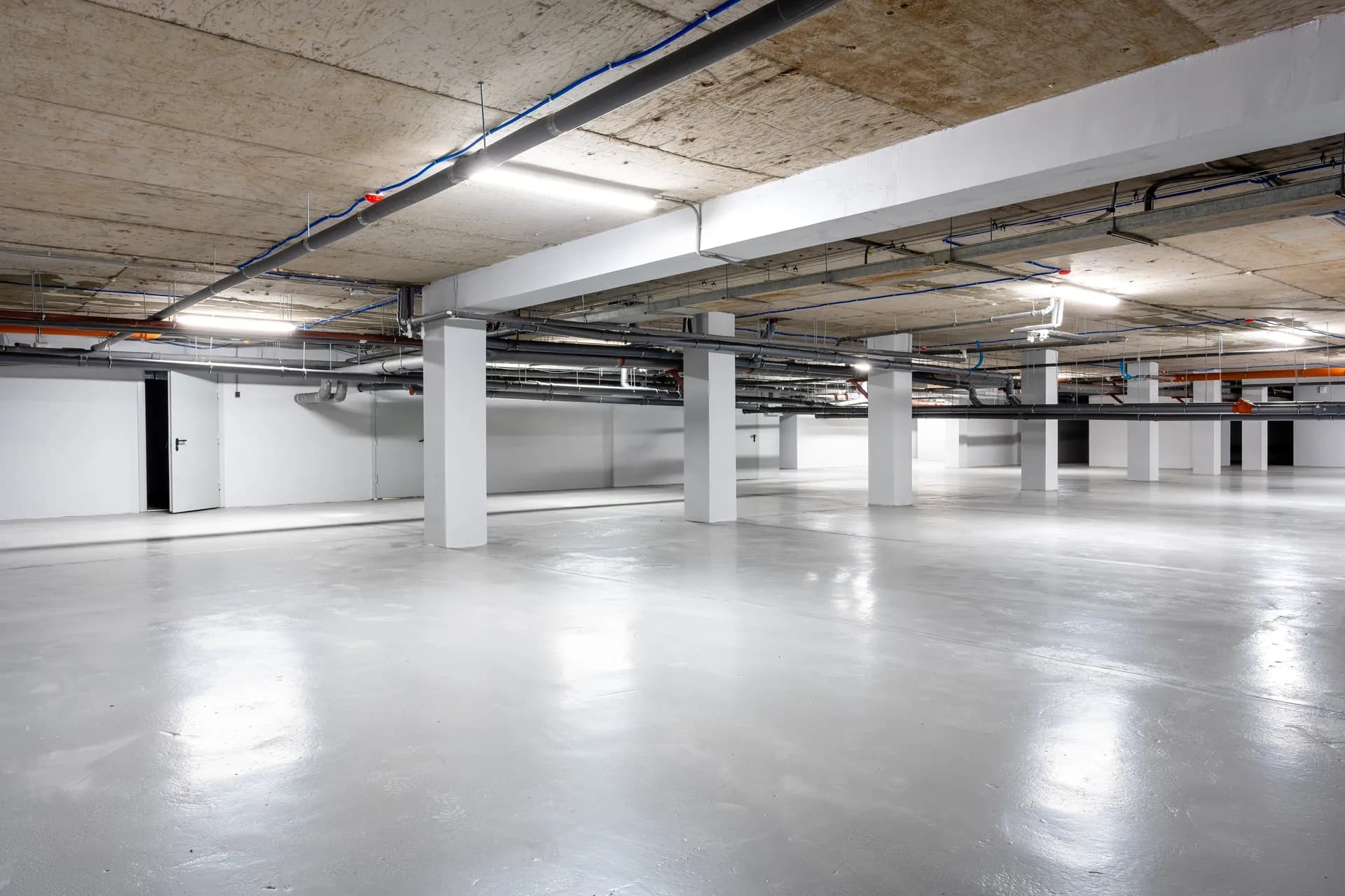 Coated parking structure floor