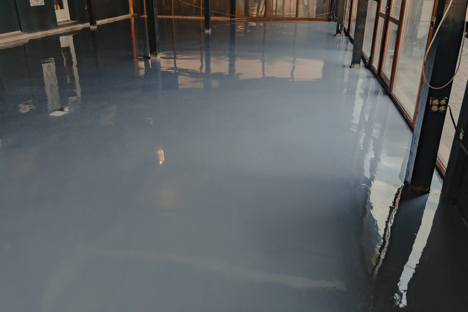 Floor after a high-gloss epoxy coating (illustrative)